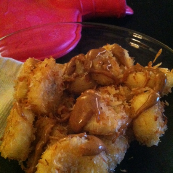 Bananas coated in coconut and fried in coconut oil, topped with almond butter